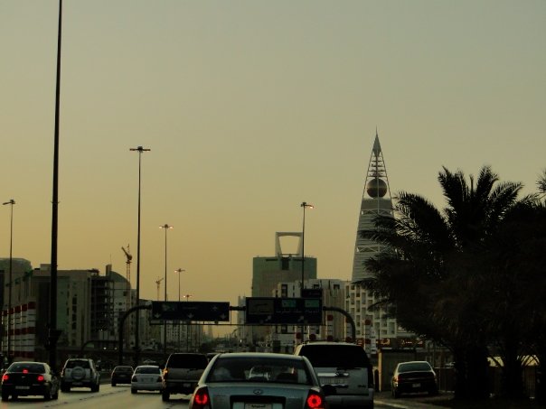 Riyadh's business-district skyline at dusk with Al Faisaliah tower in 2009, where hiring costs in Riyadh are set