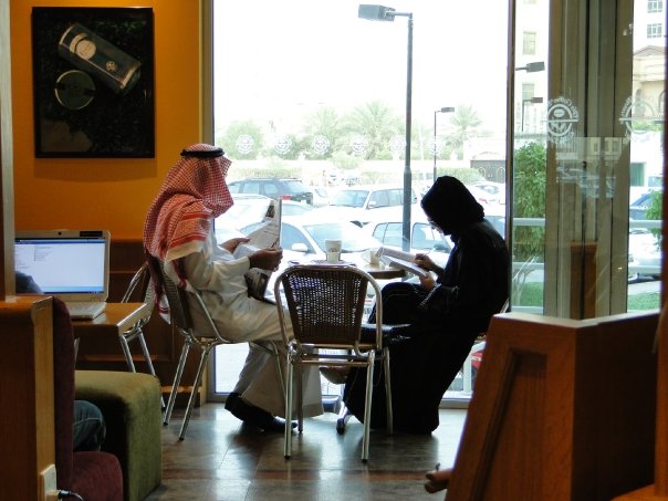 Man working on a laptop in a Riyadh cafe in 2009, the everyday texture of doing business in Saudi Arabia