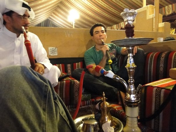 Young Saudi and expat friends around a shisha table in a Riyadh majlis, 2009, building an expat social life
