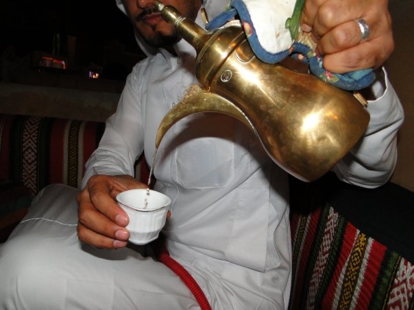 Pouring Arabic coffee from a dallah at a Riyadh gathering in 2009, the ritual of Saudi hospitality for newcomers