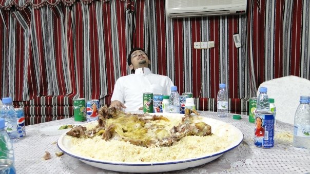 Whole lamb over rice shared at a Riyadh gathering in 2009, the Saudi hospitality that welcomes expats